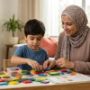 A mother helping her child focus through a structured play activity for children's attention problems at home.